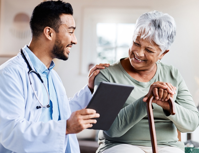 Happy patient talking with doctor about upcoming eye surgery